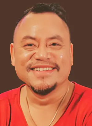 Portrait of a man smiling in red shirt