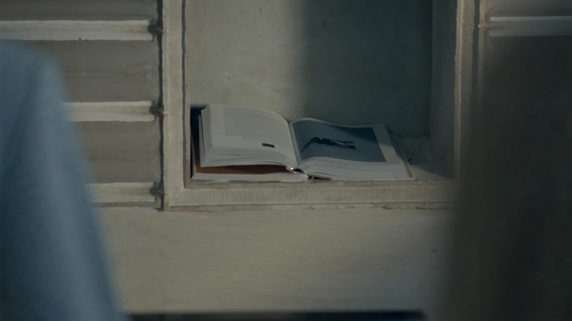 Writing alcove with a single deeply lit open book, illustrating ChatGPT depth over breadth