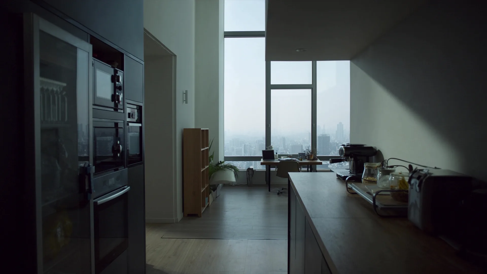 Modern aparthotel living space with city view and integrated workspace, representing serviced residence AI visibility measurement