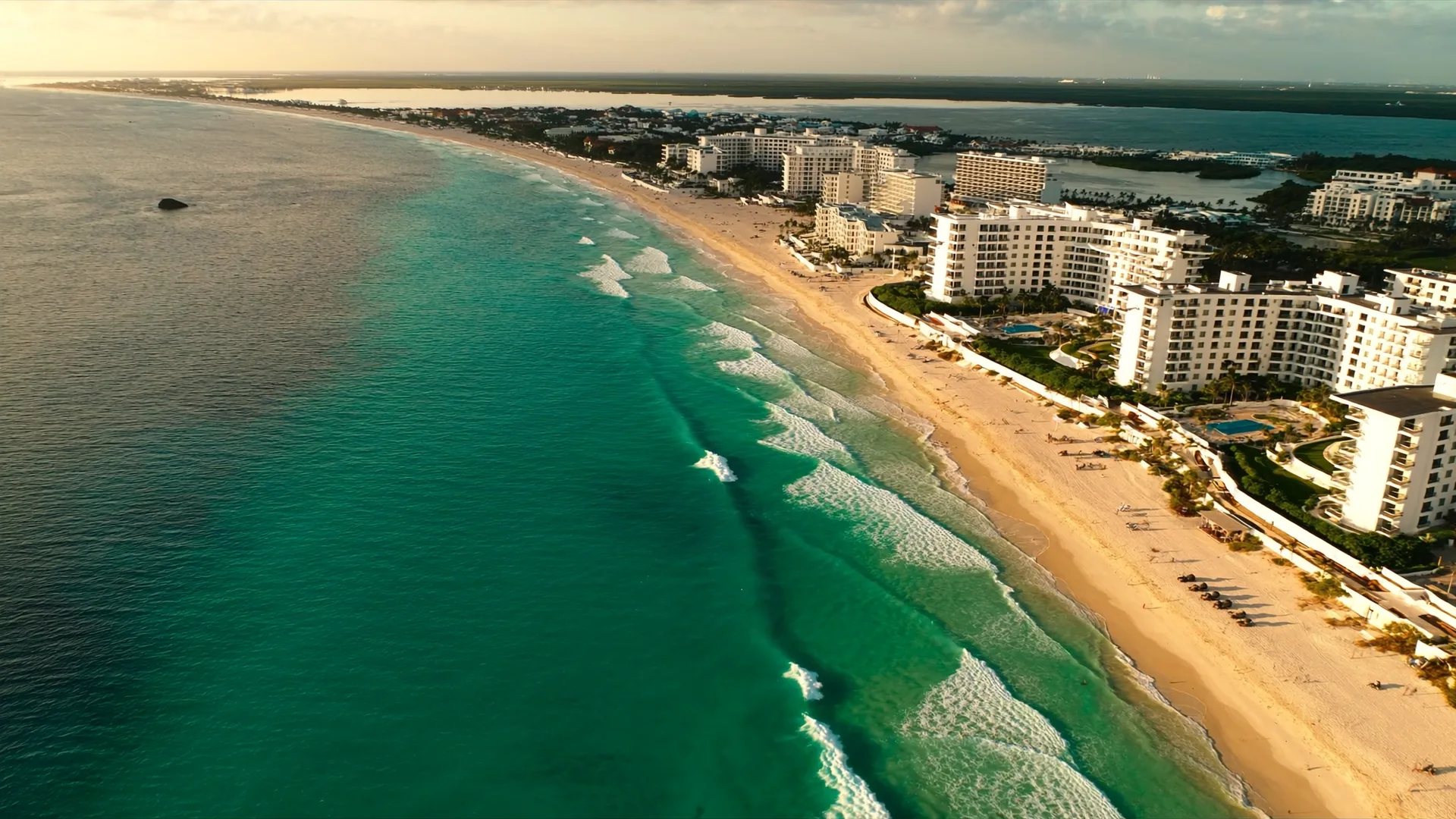 Caribbean coastline aerial view representing the AI visibility landscape for island hospitality properties in the region