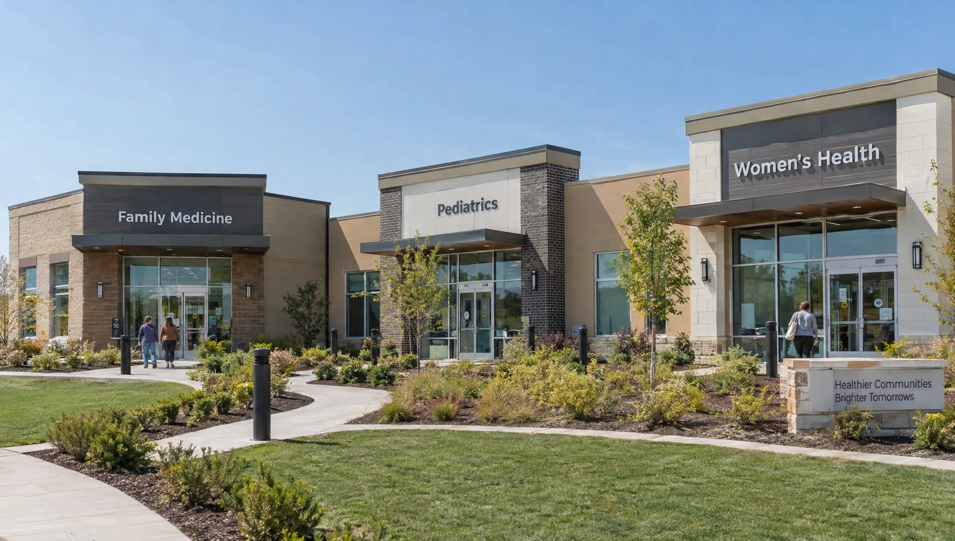 Three separate clinic entrances sit along a shared campus walkway, each representing a distinct location within a healthcare franchise.